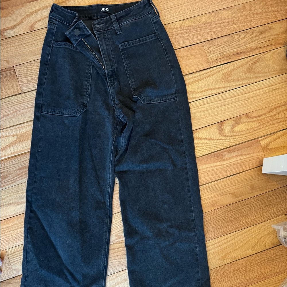 JBD black jeans with pockets in front. High rise and boot cut wide leg